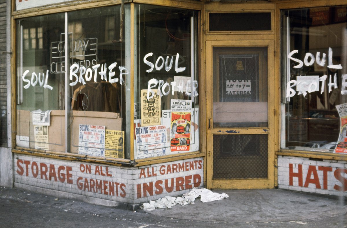 Subject: "Soul Brother" written on the windows of an African American owned business so that rioters won't vandalize or destroy during race riots.  Detroit, Michigan 1967 Photographer- Howard Bingham Time Inc NOT OWNED merlin-1153193