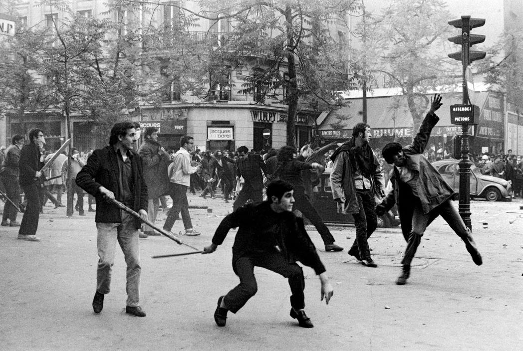 FRANCE. Paris. May 6th 1968. 6th arrondissement. Boulevard Saint Germain. Students hurling projectiles against the police.