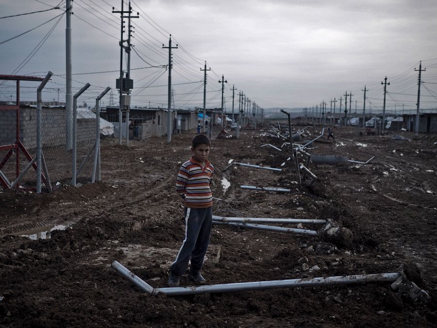 IRAQ. Kurdistan. December 4, 2014. 12-year-old Salah Sleman, a Kurdish boy from the Kurdish-Syrian town of Kobani, now lives at a camp i Arbad for displaced families on the outskirts of Suleimaniyah.