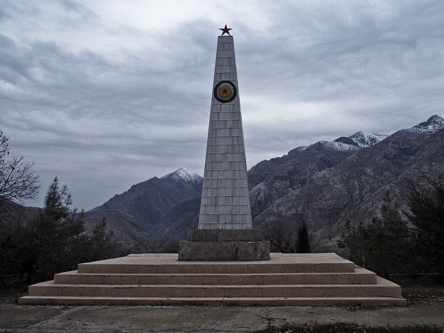 IRAQ. Kurdistan. December 1, 2014. A monument erected in honor of fallen PKK fighters overlooks the Qandil Mountains in Iraqi Kurdistan. In the 1990s, during some of the deadliest years of the PKK-Turkey conflict, the PKK set up bases across the rugged Qandil Mountains in Iraqi Kurdistan, near the border of Iran. Since then, Turkey has periodically carried out air strikes in Qandil, aiming to hit the thousands of fighters who train and live in the moutain. But the PKK fighters in Qandil operate in various pockets of the mountain, and often live in caves, making it near impossible for Turkish jets to precisely target them. On several occasions, Turkish jets accidentally hit Iraqi Kurdish villagers living in the area instead. This prompted tensions between the the regional Iraqi Kurdish government and Turkey. In recent years, Turkey and the PKK have embarked on a fragile peace process, which has spared Qandil some of the heavy shelling of earlier years. But events in Syria and Iraq this past summer, in particular Turkish sensitivities to the PKK's increasingly prominent role in fighting the Islamic State and PKK allegations that Turkey was at times conspiring with IS to bring about the fall of Kobani, have strained the peace process. If the process collapses, the relative calm in Qandil may break as well.
