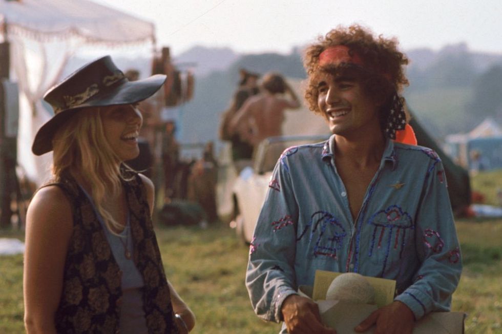 A pair of unidentified festival goers share a laugh during the Woodstock Music and Arts Fair, Bethel, New York, August 1969. The festival ran from August 15 to 18. (Photo by Ralph Ackerman/Getty Images)