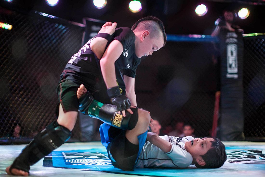 Mixed Martial Arts fighters Justin Ramirez, 7, and Chris Arrey, 7, fighting in the octagon in United States Fight League(USFL) All-star Pankration show at Blue Water Casino in Parker, Arizona on 25th of October 2013. Photo: Miikka Pirinen