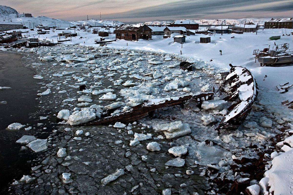 Sunken boats and abandoned houses lay rotting by an icy bay in Teriberka, a former prosperous fish-processing community waiting for an economic boom through gas production. Teriberka rose to international fame in the last decade after Gazprom engineers discovered one of the largest gas fields off its shore. International oil and gas companies rushed to bid for rights to develop the Shtokman gas field with Gazprom. However, the project has been put on ice after since the collapse of the gas prices.
